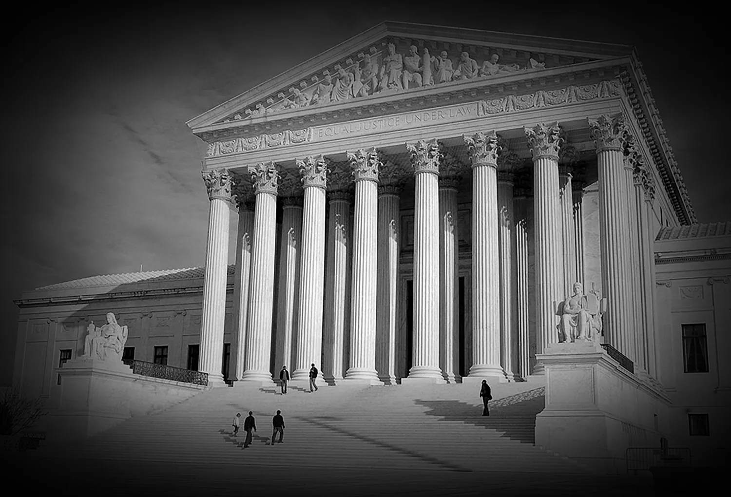 The west front of the United States Supreme Court building, in black and white, with the words Equal Justice Under Law on the pediment